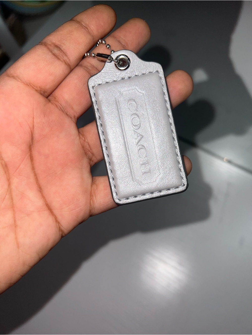 COACH Silver bag tag